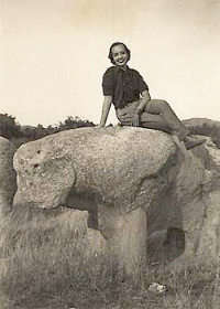 Vincente's daughter, Luisa, sitting atop an ancient bear shaped stone.